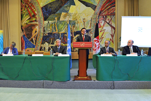 Afghanistan Minister of Finance, Mr. Omar Zakhilwal speaks at the podium during the library talk. Seated left to right is Ms. Sally Fegan-Wyles, UNITAR Executive Director; Mr. Kassym-Jomart Tokayev, UNOG Director-General; Ambassador Tarzi, Afghanistan Permanent Representative to the United Nations in Geneva; and Mr. David Chikvaidze, UNOG Chief Librarian.