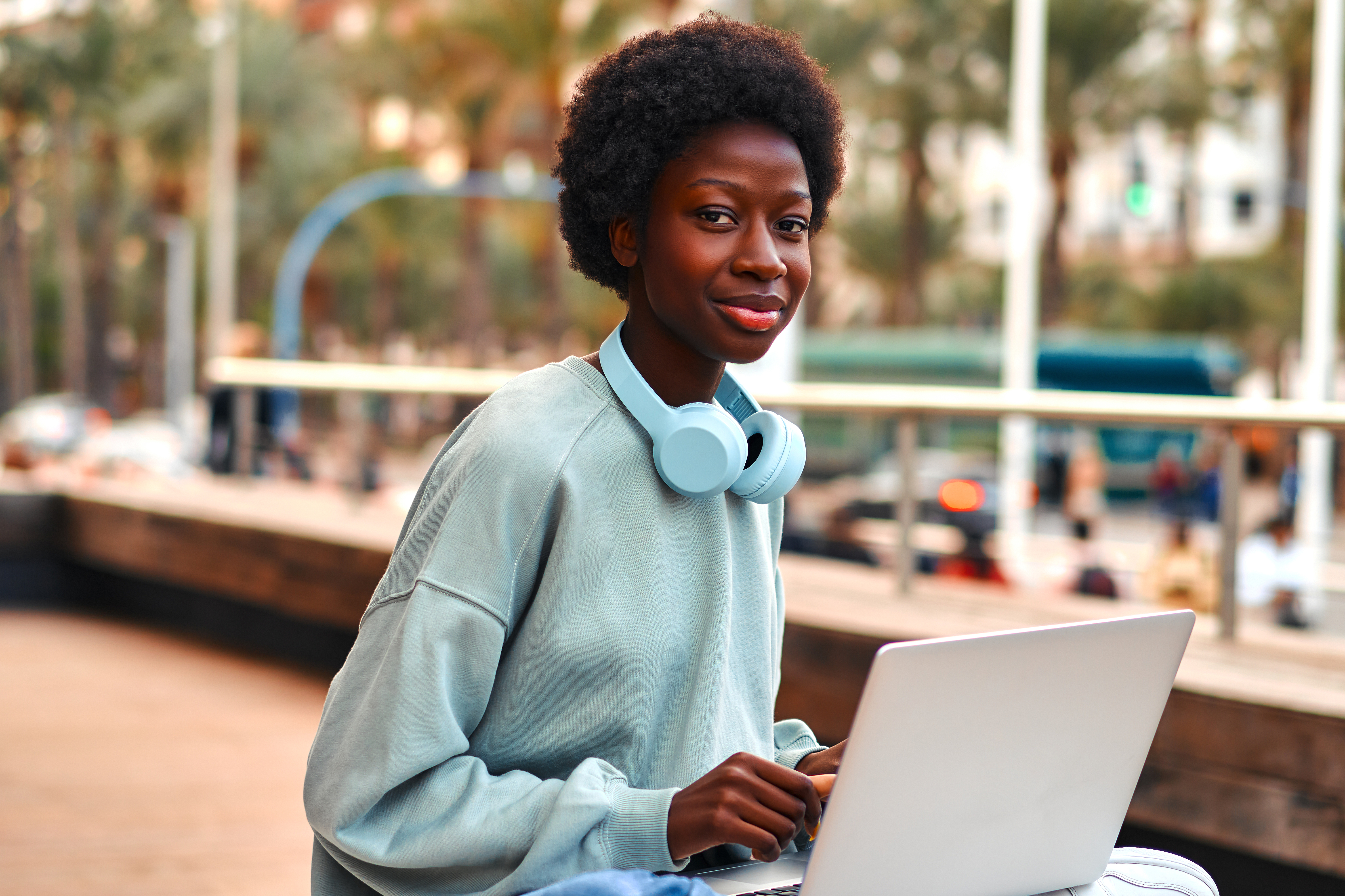 https://unitar.org/sites/default/files/media/image/african-american-woman-with-laptop-outdoors-2023-03-22-15-30-04-utc.jpg?utm_source=chatgpt.com