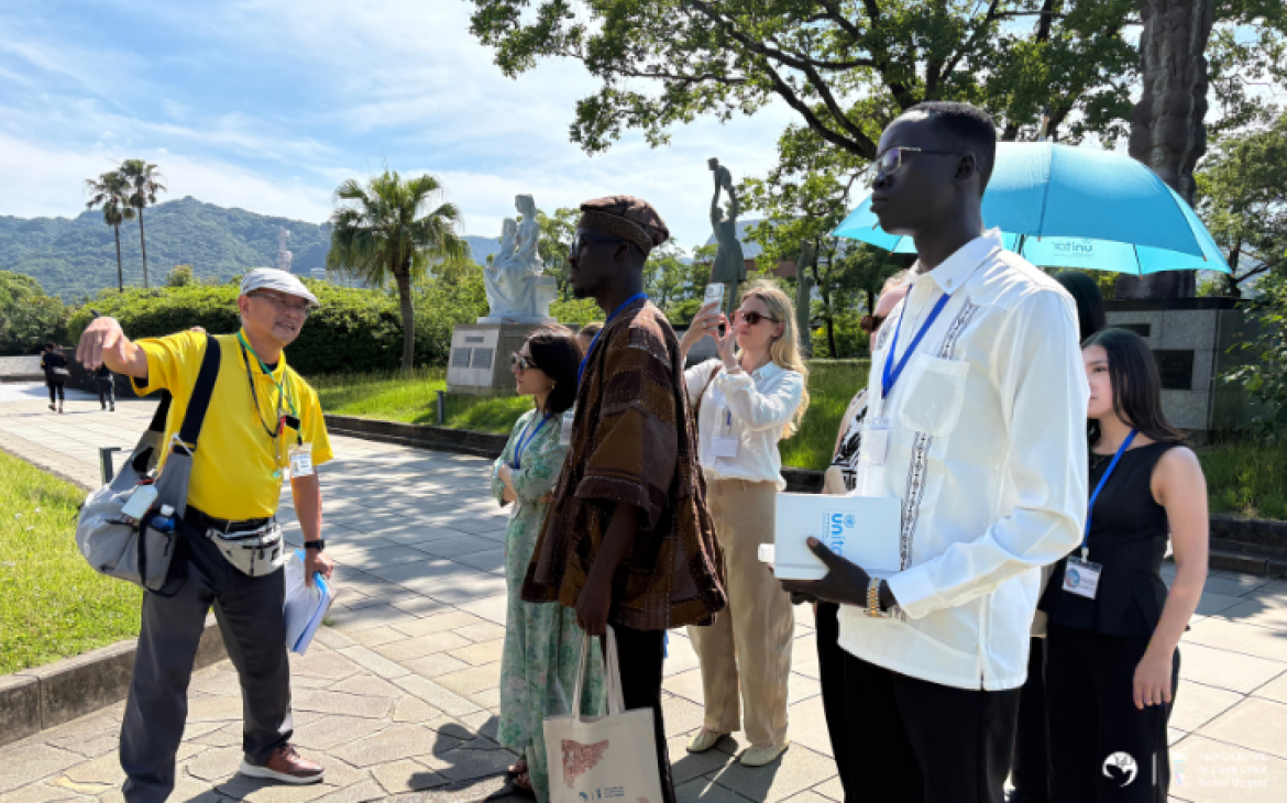 YLF participants listening to the stories at a peace park during a study tour