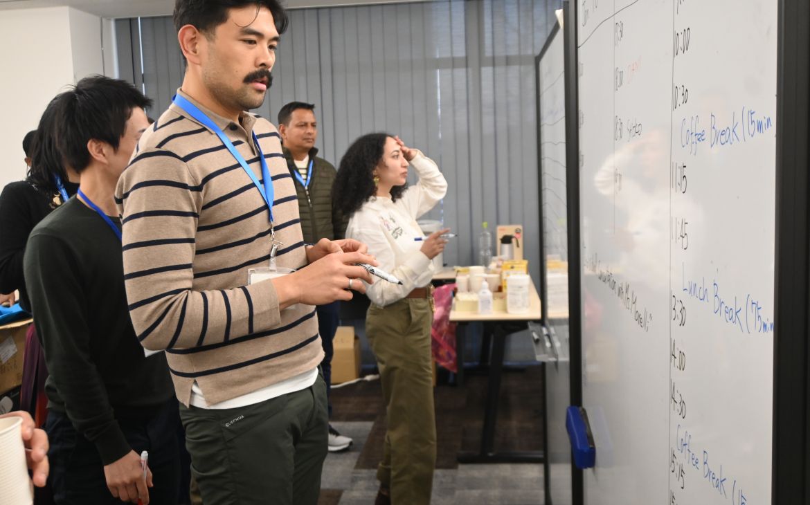 A participants looking at the white board