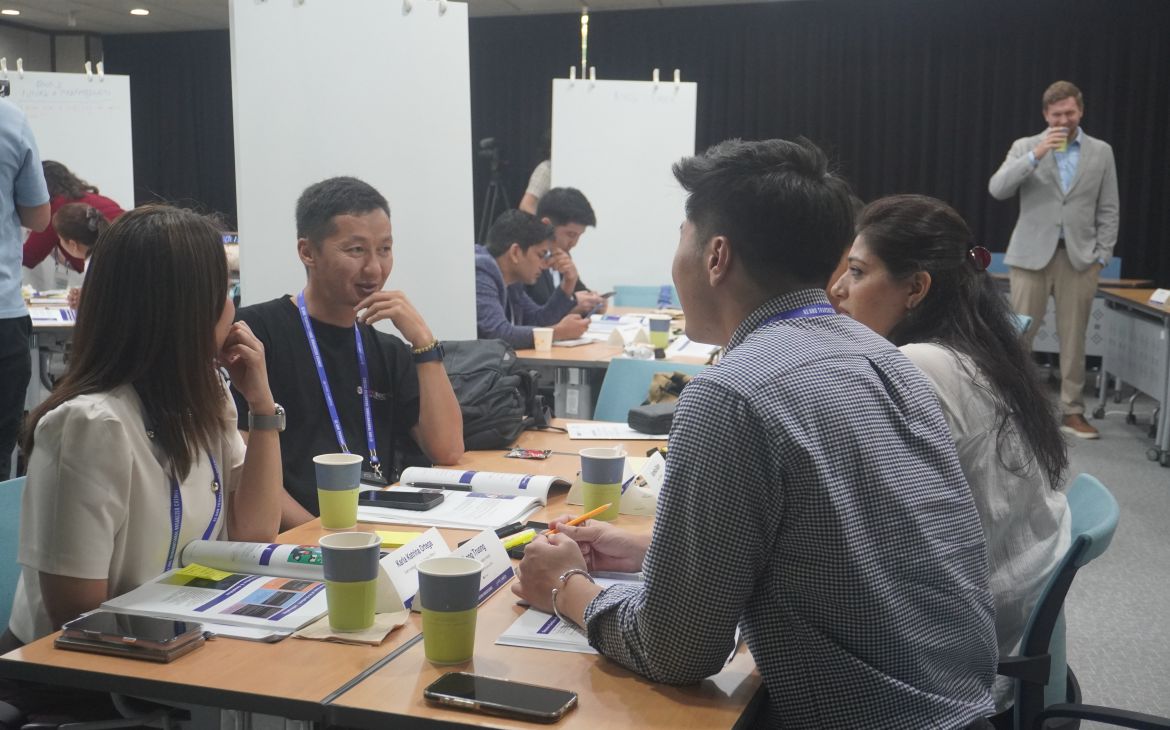 Participants collaborating during an action-planning session to develop practical strategies.