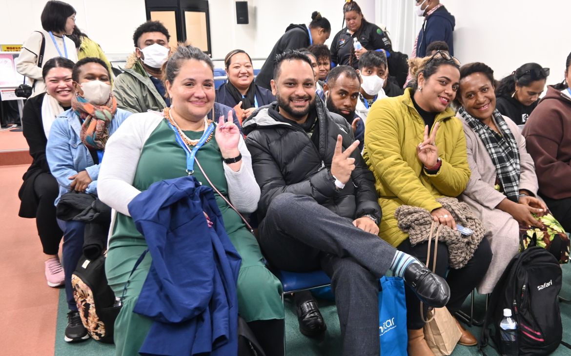 A large group of training participants listening to a lecture