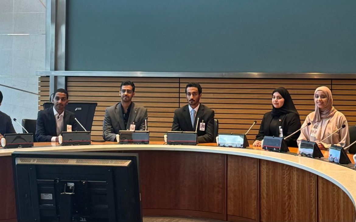 Group photo of the fellows sitting around a table