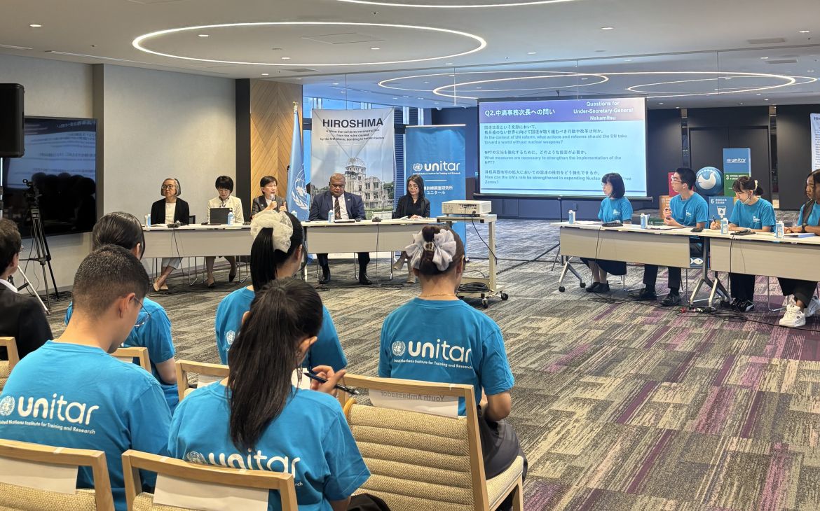 Participants sitting and listening to panellists speak