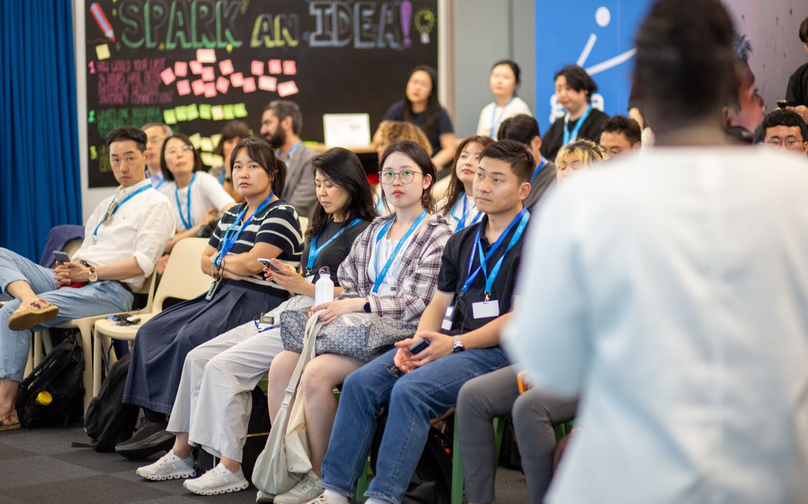 Participants sit and listen to the programme.