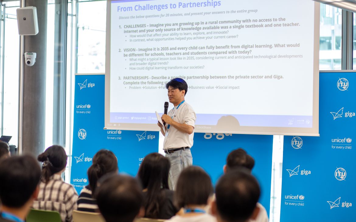 A participant presents in front. 