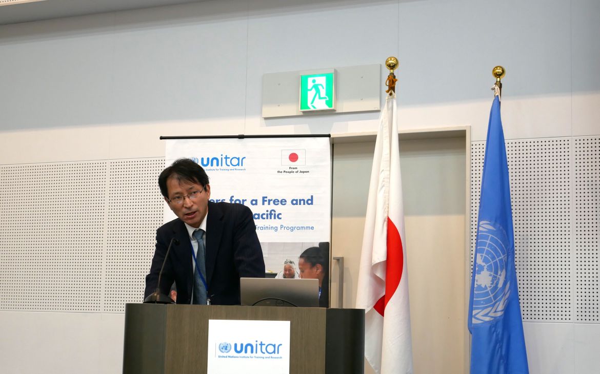 Photo of Mr. ANDO Shigemi, Director, Global Issues Cooperation Division, Ministry of Foreign Affairs of Japan, speaking at the public event