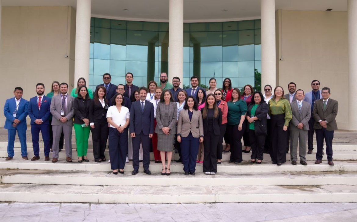 Participants and Speakers gather for a group photo