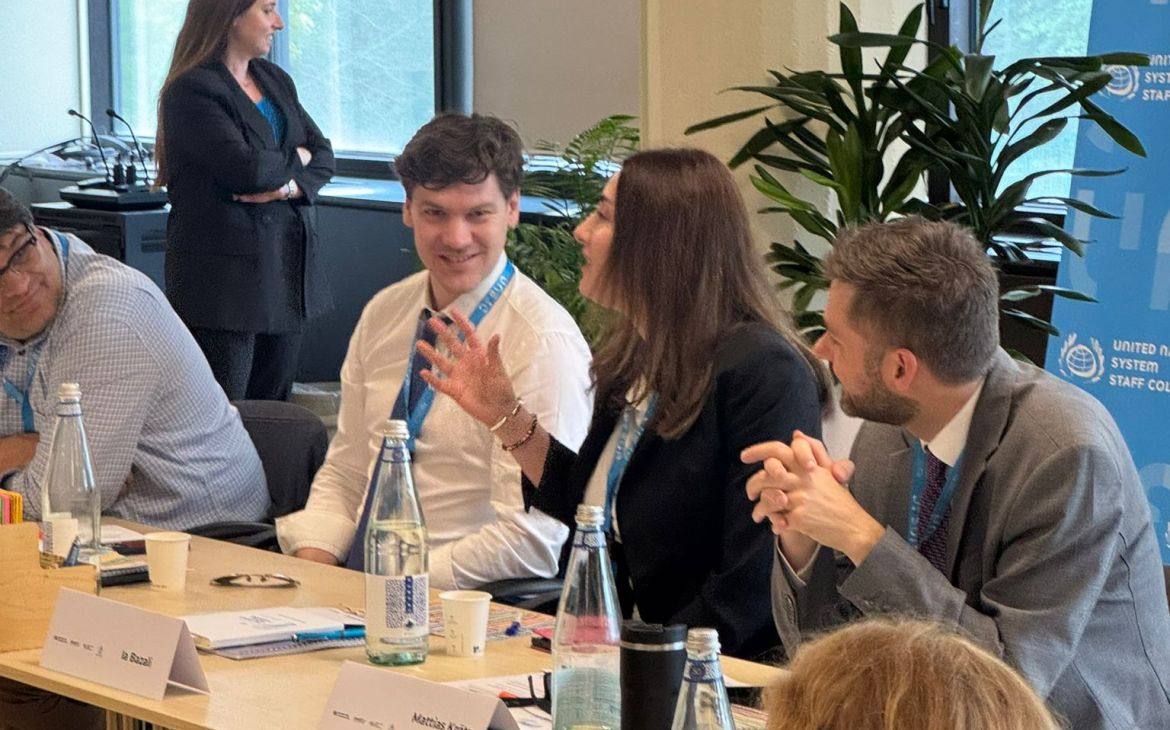 Candid image of participants speaking amongst eachother