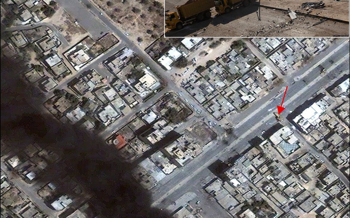 a photograph of dump trucks used as a blockade in Misratah is precisely located in a satellite image from 23 April 2011 (see red arrow). a photograph of dump trucks used as a blockade in Misratah is precisely located in a satellite image from 23 April 2011 (see red arrow).
