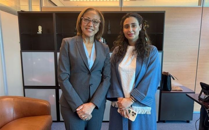 Photo of H.H. Princess Abeer S. Al Saud and Ms. Michelle Gyles-McDonnough, UN ASG and UNITAR Executive Director standing and facing the camera in a room
