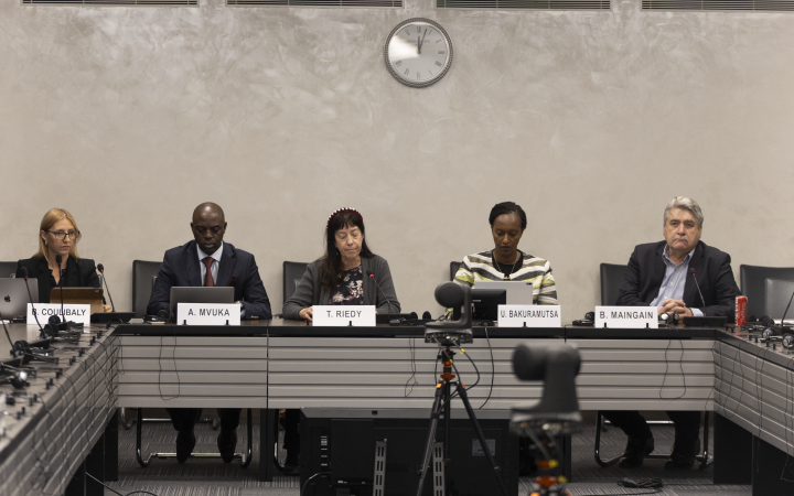 Four panelists and moderator engaging in dialogue