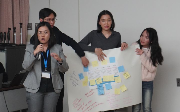 Diplomats conducting presentation with local youth