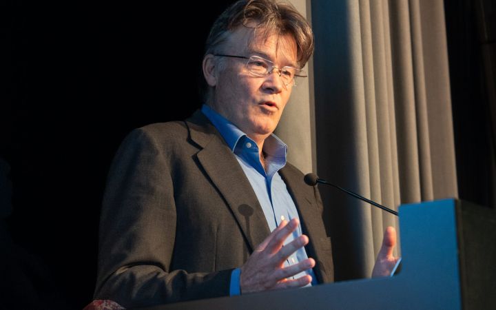 Angus Mackay addressing the audience at the No Borders for Climate Action event.