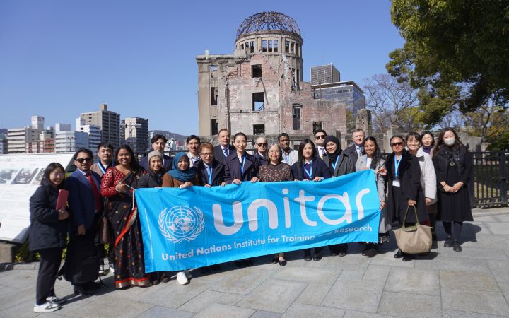 Group photo of participants in front of the Atomic Bomb Dome.