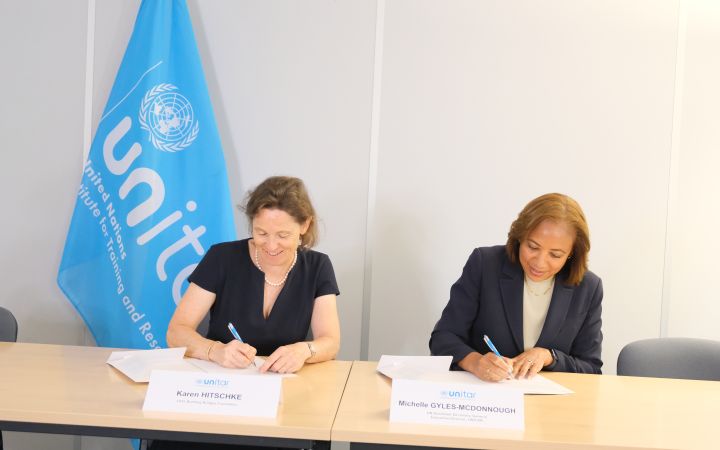 Karen Hitschke, CEO of Building Bridges, and Michelle Gyles-McDonnough, UN Assistant Secretary-General and Executive Director of UNITAR, signing the Memorandum of Understanding between UNITAR and the Building Bridges Foundation