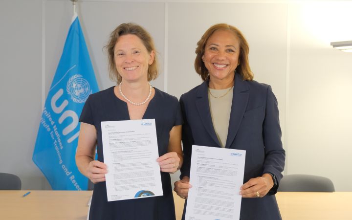 Karen Hitschke, CEO of Building Bridges, and Michelle Gyles-McDonnough, UN Assistant Secretary-General and Executive Director of UNITAR, holding the signed MoU.
