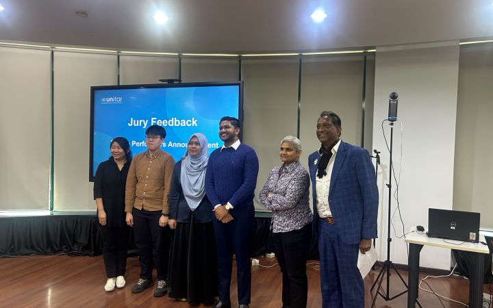 Group photo of Krishnan's team and the panelists. 
