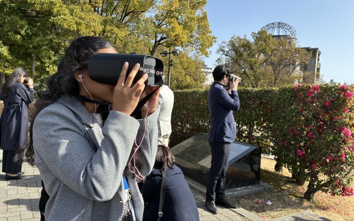 Participants taking a VR tour at the Hiroshima Peace Memorial Park