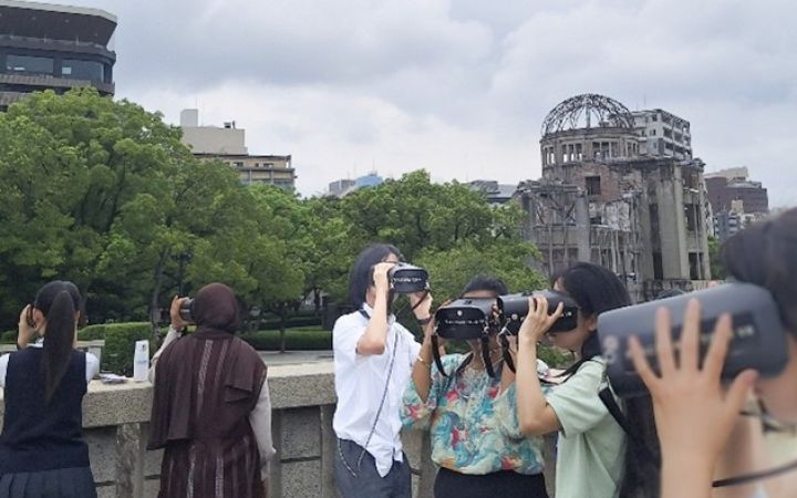 UNITAR Digital Storytelling Training Programme Participant using a VR goggle at the Hiroshima Peace Memorial Park