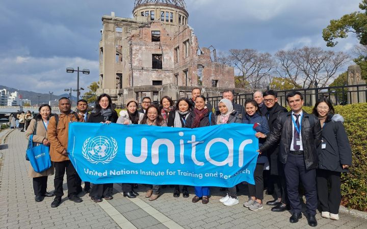 Group photo of the participants from UNITAR Hiroshima Nuclear Disarmament and Non-Proliferation training programme at Hiroshima Peace Memorial Park.