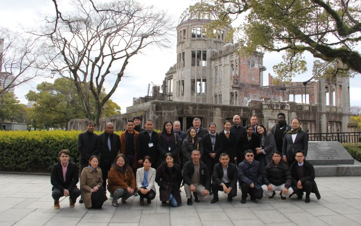 Group photo of UNITAR Nuclear Disarmament and Non Proliferation Training Programme participants, staff and  resource persons by the Atomic Bomb Dome in Hiroshima, Japan