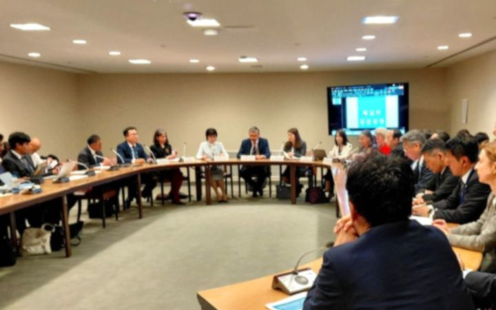2026 NPT Review Conference Side Event discussion taking place in a room with a large group