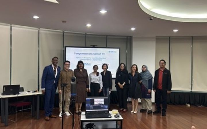 A group photo of the team after their presentation.