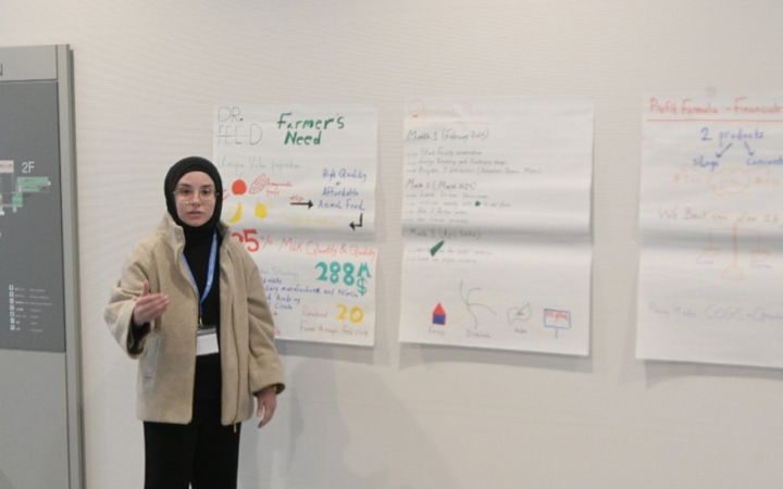 A participant from the UNITAR RISE LAB programme conducting a presentation