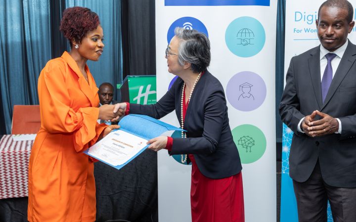 Destina Mensah receiving her certificate at the graduation ceremony of the UNITAR “Developing Essential Digital Skills for Women and Youth in Africa” programme