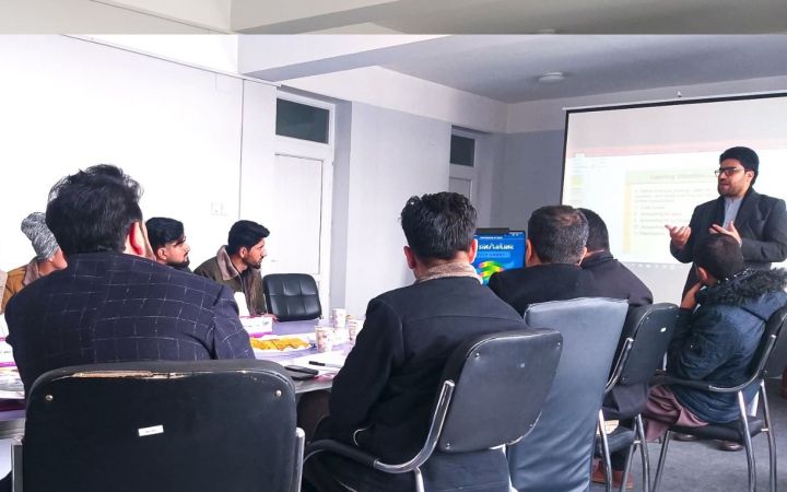 Afghan men seated in a room for the entrepreneruship training programme
