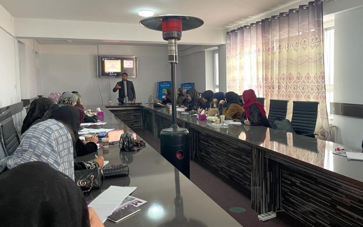 Afghan women seated in a room for the entrepreneruship training programme