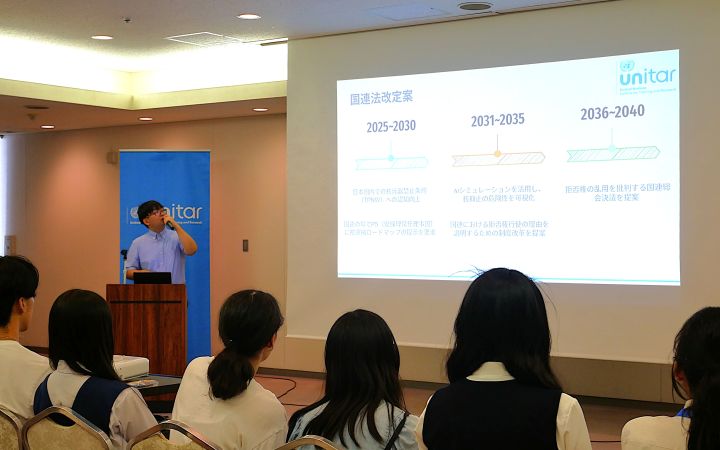 Hiroshima Youth Ambassador participant presenting in front of fellow participants