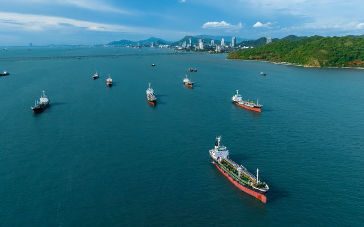Aerial top view ship tanker crude oil on the sea for transportation, Sea transportation of crude oil petroleum tanker to oil terminal for loading and global business logistic.