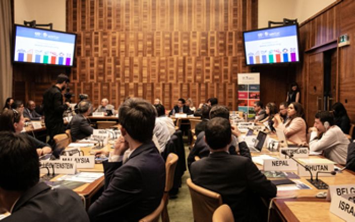Participants of th meeting listening to a presentation