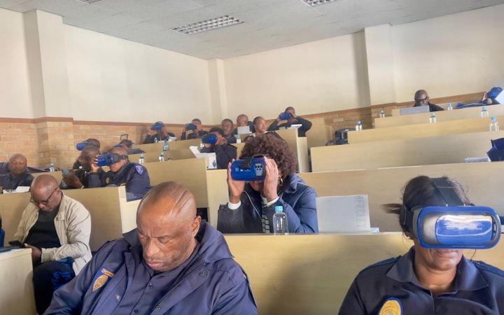 Participants using Virtual Reality goggles to observe the impacts of alcohol impairment on driving performance