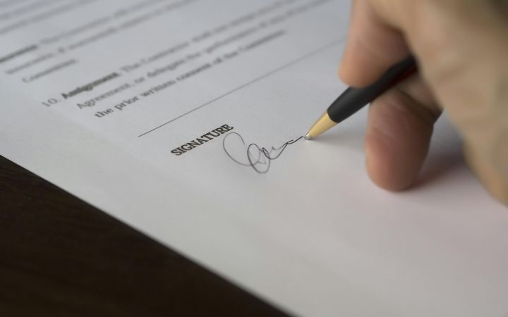 Signing a paper