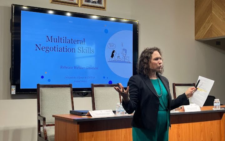 Dr. Rebecca Weber Gaudiosi delivering a training on Multilateral Negotiations